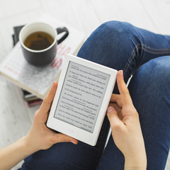 person reading on ereader, how i started marketing my ebook